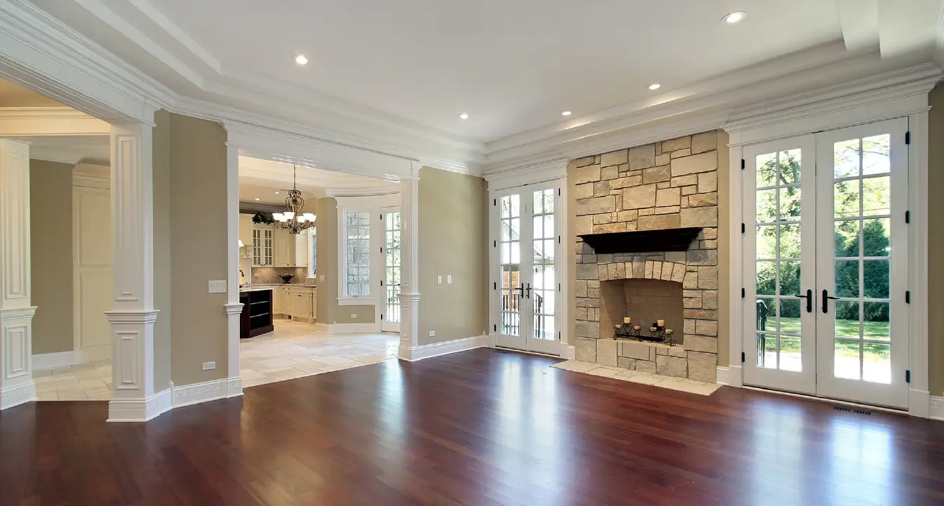 A cozy family room featuring elegant wood trim and french doors