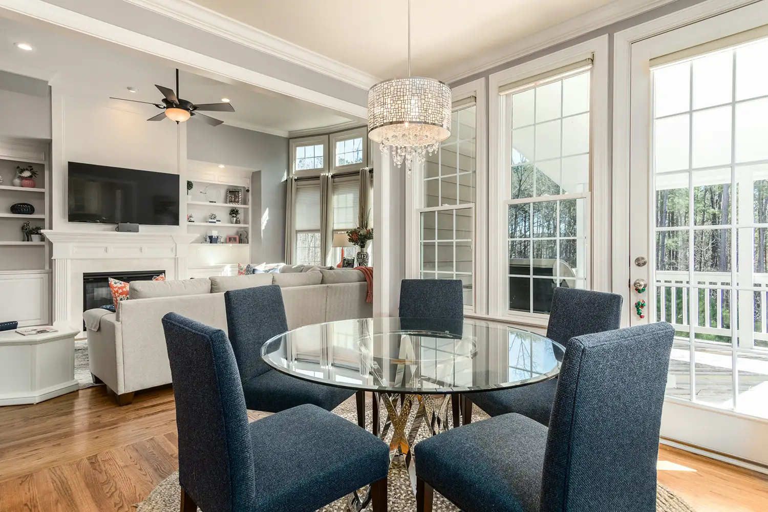 A dining area surround by elegant french doors and custom moulding